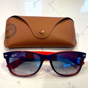 Ray-Ban RB2132 “New Wayfarer” in Orange/Navy with gradient blue lenses.